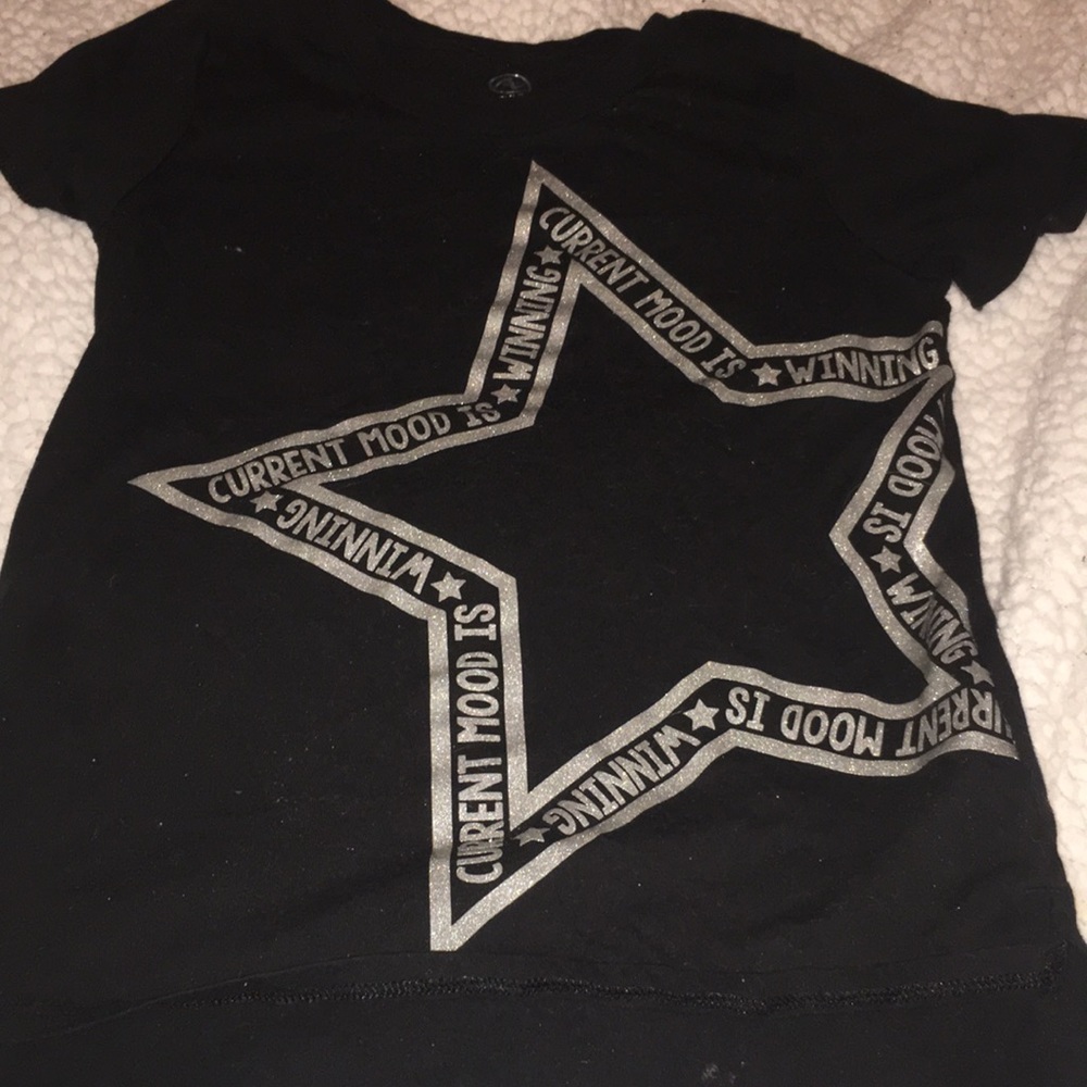 It’s a black sport shirt for kids medium 7-8